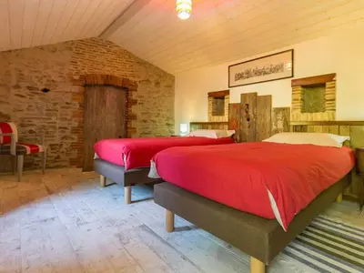 Coin salon dans l'établissement Maison charmante à Rouans - Wifi, Animaux admis - FR-1-306-1059