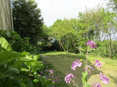 Jardin de l'établissement Gîte calme avec jardin clos, 3 chambres, équipements bébé, proche de Nantes et sites naturels - FR-1-306-1141