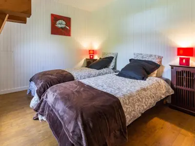 Un ou plusieurs lits dans un hébergement de l'établissement Gîte rénové avec jardin privé, proche de la Baule et Guérande, idéal pour 4 personnes. - FR-1-306-1163