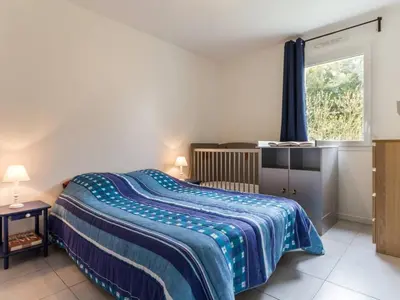 Un ou plusieurs lits dans un hébergement de l'établissement Maison contemporaine à Nozay avec jardin clos, proche Nantes : 3 chambres, Wi-Fi, garage vélos/motos - FR-1-306-1178