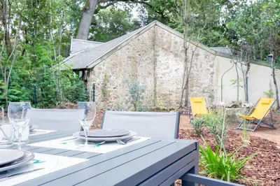 Jardin de l'établissement Maison pour 5 personnes - 500m de la plage