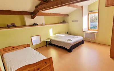 Un ou plusieurs lits dans un hébergement de l'établissement Chambres d hôtes Le Bois Corbeau