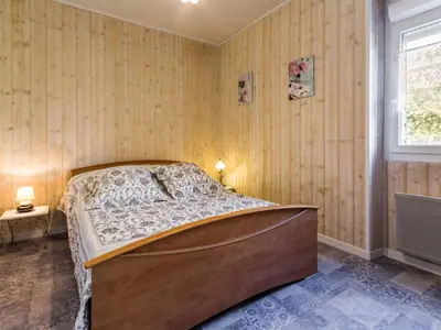 Un ou plusieurs lits dans un hébergement de l'établissement Gîte champêtre rénové avec terrasse & équipements, proche Pornic - animaux acceptés - FR-1-306-1027