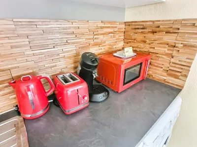 Cuisine ou kitchenette dans l'établissement Le Rocher de Bel Air -40m2 -Chaleureux 3 étoiles