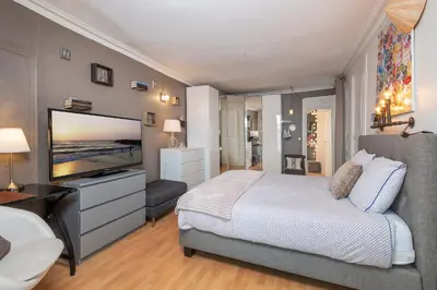 Un ou plusieurs lits dans un hébergement de l'établissement Appartement calme et cosy, Place du Ralliement
