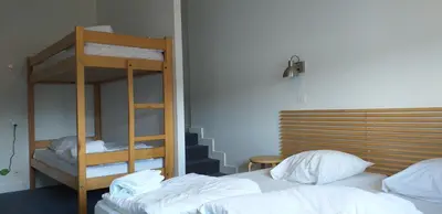 Un ou plusieurs lits dans un hébergement de l'établissement HOSTEL Les Bois Verts - Les Herbiers