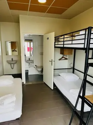 Un ou plusieurs lits dans un hébergement de l'établissement HOSTEL Les Bois Verts - Les Herbiers