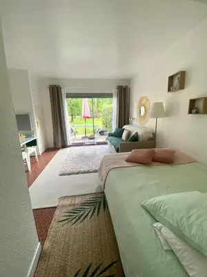 Un ou plusieurs lits dans un hébergement de l'établissement Cottage au sein du 