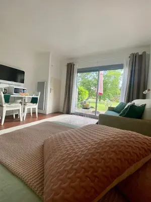 Un ou plusieurs lits dans un hébergement de l'établissement Cottage au sein du 