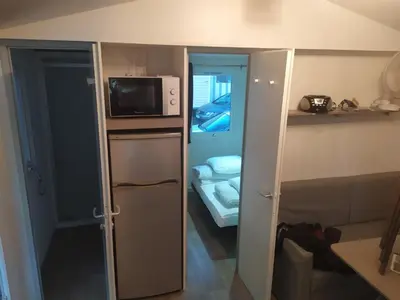 Cuisine ou kitchenette dans l'établissement camping 4**** proche mer