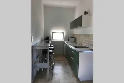 Cuisine ou kitchenette dans l'établissement Au coeur de la Toscane Angevine