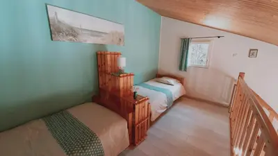 Un ou plusieurs lits dans un hébergement de l'établissement Maison de vacances 300 m de la mer proche forêt