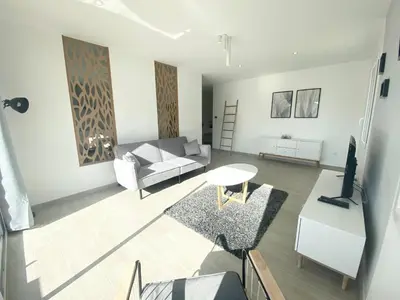 Coin salon dans l'établissement Belle maison de 140m2, proche centre ville