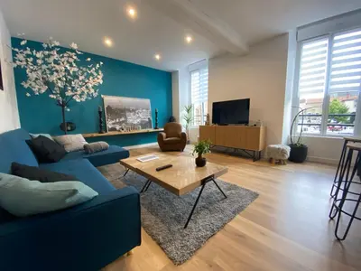 Télévision ou salle de divertissement dans l'établissement Appartement 97 M2 proche Puy du fou