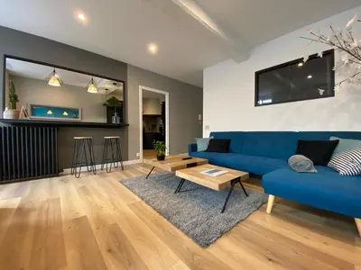 Coin salon dans l'établissement Appartement 97 M2 proche Puy du fou