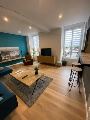 Télévision ou salle de divertissement dans l'établissement Appartement 97 M2 proche Puy du fou