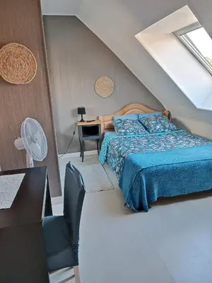 Un ou plusieurs lits dans un hébergement de l'établissement Chambre chez l'habitant