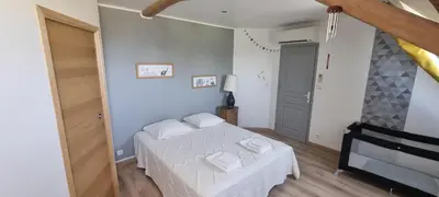 Un ou plusieurs lits dans un hébergement de l'établissement Maison de Campagne de charme avec piscine privée classée 3 étoiles