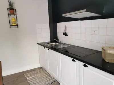Cuisine ou kitchenette dans l'établissement Duplex INDEPENDANT Centre ville