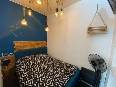 Un ou plusieurs lits dans un hébergement de l'établissement Appartement cosy à Nantes avec terrasse