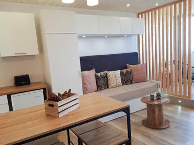 Coin salon dans l'établissement Magnifique Studio Face Mer avec Place Privative.