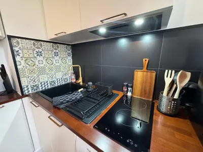Cuisine ou kitchenette dans l'établissement L'Escale - 300 m Océan - Hyper Centre - Lumineux - Garage Privatif