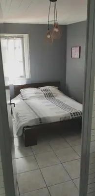 Un ou plusieurs lits dans un hébergement de l'établissement Appartement spacieux et lumineux Secteur Petit Marché à 5 min a pied de la plage