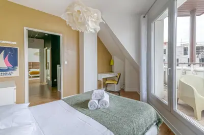 Un ou plusieurs lits dans un hébergement de l'établissement NYMPHÉA - Duplex Hauts Pavés
