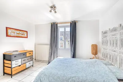 Un ou plusieurs lits dans un hébergement de l'établissement MONKEY PARADISE Bel appartement vue LOIRE