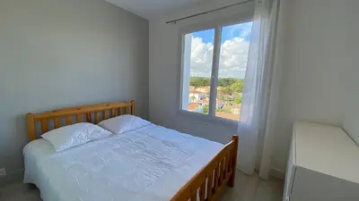 Un ou plusieurs lits dans un hébergement de l'établissement Appartement 3 chambres, panoramique vue océan