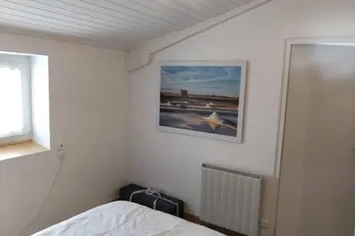 Un ou plusieurs lits dans un hébergement de l'établissement LA MAISON BLEUE