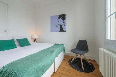 Un ou plusieurs lits dans un hébergement de l'établissement Appartement Coeur de Ville rue Saint-Laud