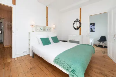 Un ou plusieurs lits dans un hébergement de l'établissement Appartement Coeur de Ville rue Saint-Laud