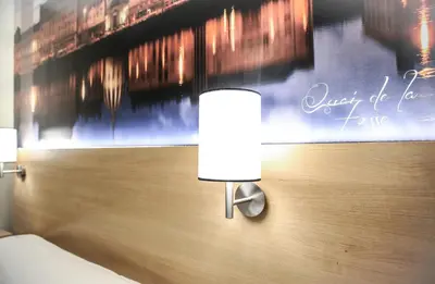 Un ou plusieurs lits dans un hébergement de l'établissement Hôtel Inn Design & Restaurant Châteaubriant