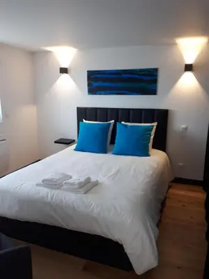 Un ou plusieurs lits dans un hébergement de l'établissement Maison et grande terrasse face mer