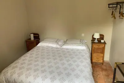 Un ou plusieurs lits dans un hébergement de l'établissement LA PETITE MAISON de Chenillé Changé