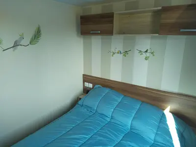 Un ou plusieurs lits dans un hébergement de l'établissement Mobilhome camping proche des plages