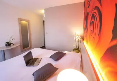 Un ou plusieurs lits dans un hébergement de l'établissement Hôtel Inn Design & Restaurant Challans
