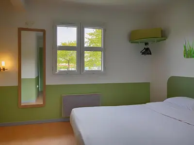Un ou plusieurs lits dans un hébergement de l'établissement Ibis Budget Redon