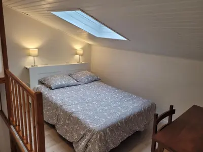 Un ou plusieurs lits dans un hébergement de l'établissement Gîte Mélisse