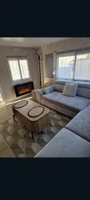 Coin salon dans l'établissement Mobilhome spacieux