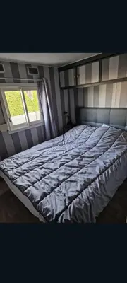 Un ou plusieurs lits dans un hébergement de l'établissement Mobilhome spacieux