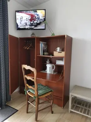 Télévision ou salle de divertissement dans l'établissement Le moulin de La Retardière