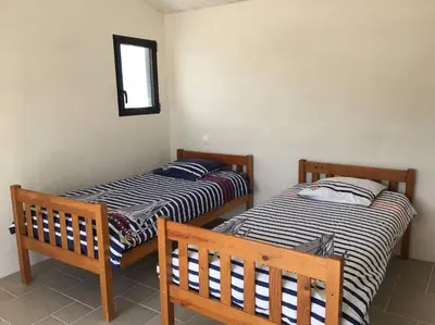 Un ou plusieurs lits dans un hébergement de l'établissement Maison au Vieil à NOIRMOUTIER