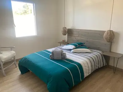 Un ou plusieurs lits dans un hébergement de l'établissement Maison en bord de mer au Domaine du Bois Soret