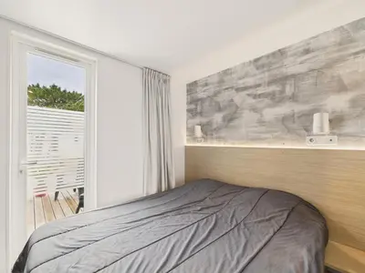 Un ou plusieurs lits dans un hébergement de l'établissement Joli chalet pour 6, résidence avec piscine