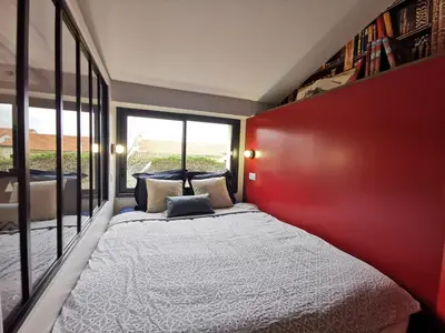 Un ou plusieurs lits dans un hébergement de l'établissement Maisonnette avec terrasse et parking - Madeleine, il était une fois