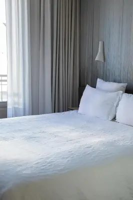Un ou plusieurs lits dans un hébergement de l'établissement OKKO Hotels Nantes Centre Ville
