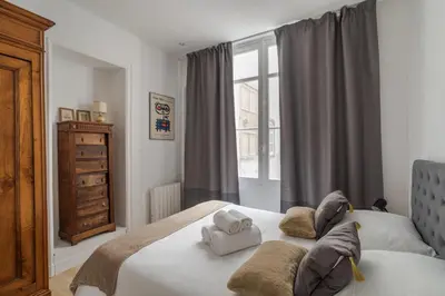 Un ou plusieurs lits dans un hébergement de l'établissement Le Saint-Clément - Quartier Historique- Spacieux 2 chambres rue du Marechal Joffre