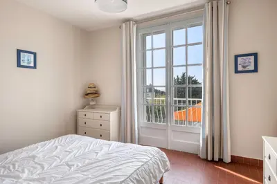 Un ou plusieurs lits dans un hébergement de l'établissement Villa à Pornic à 100m de la Plage